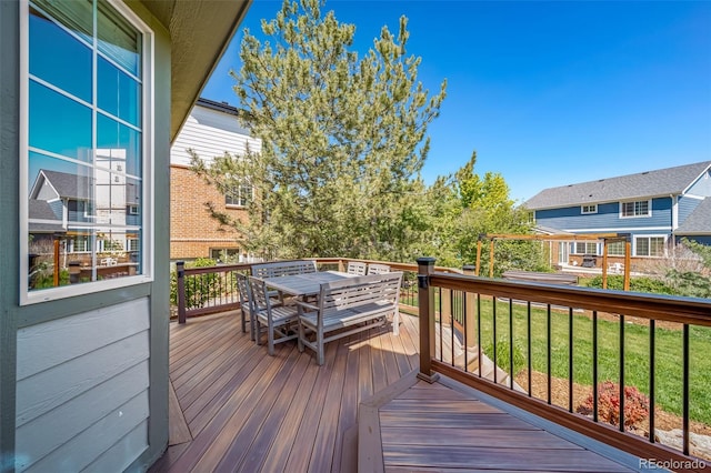 22227 E Hinsdale Ave, Aurora, CO 80016 - deck featuring outdoor dining space and a lawn