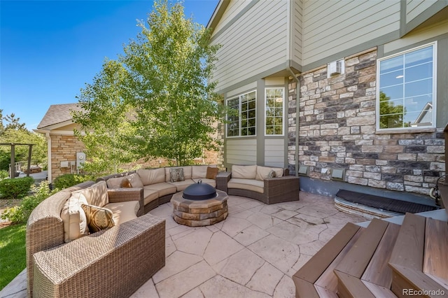 22227 E Hinsdale Ave, Aurora, CO 80016 - view of patio with an outdoor living space with a fire pit