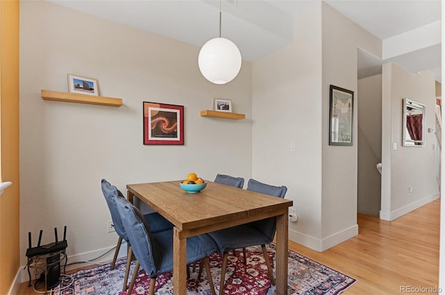 7828 W 54th Ave, Arvada, CO 80002 - dining room featuring light wood-type flooring and baseboards