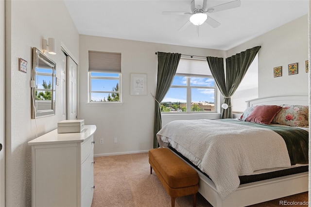 7828 W 54th Ave, Arvada, CO 80002 - bedroom with light carpet, baseboards, a ceiling fan, and a closet