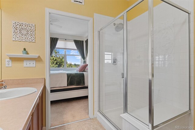 7828 W 54th Ave, Arvada, CO 80002 - bathroom featuring ensuite bath, vanity, a shower stall, and tile patterned flooring
