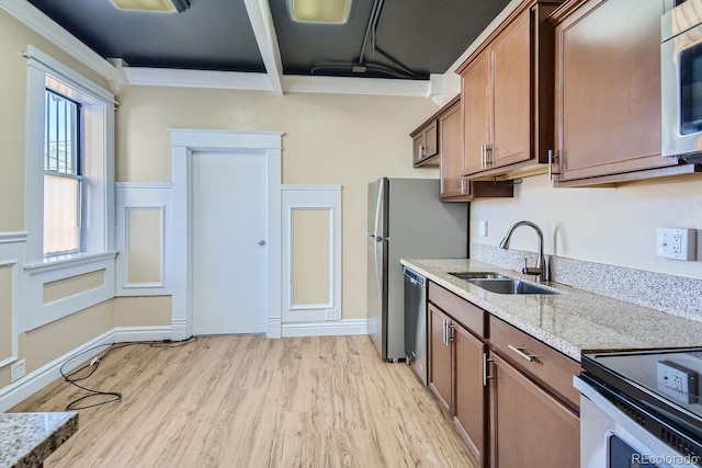 kitchen featuring stainless steel appliances, light hardwood / wood-style floors, sink, beam ceiling, and light stone countertops