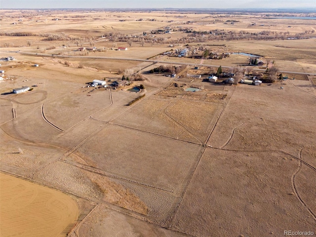 aerial view featuring a rural view and view of desert