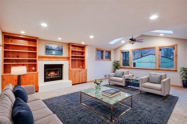 carpeted living room featuring built in features, baseboards, vaulted ceiling with skylight, recessed lighting, and a brick fireplace