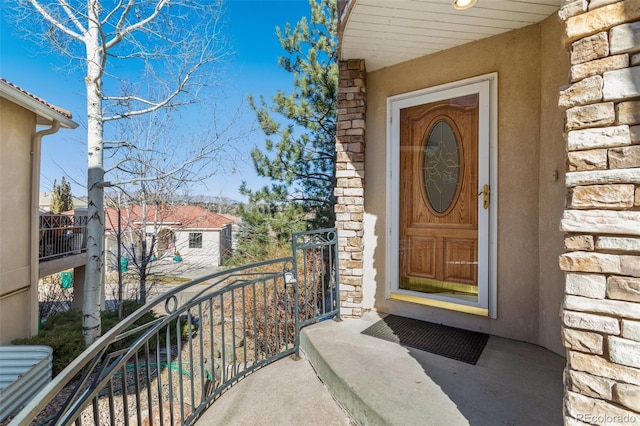 doorway to property featuring a balcony