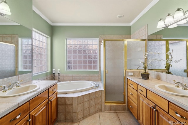 bathroom with tile patterned flooring, crown molding, and vanity