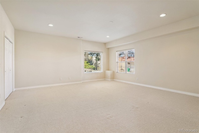 spare room with light colored carpet