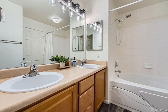 bathroom featuring vanity, shower / tub combo, and wood-type flooring