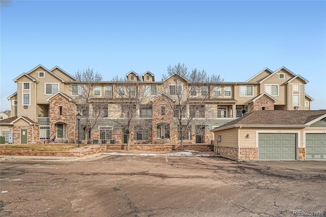 multi unit property featuring a garage