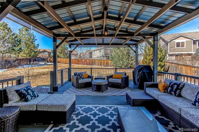 view of patio featuring outdoor lounge area, fence, and grilling area