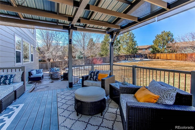 wooden terrace featuring a fenced backyard and outdoor lounge area