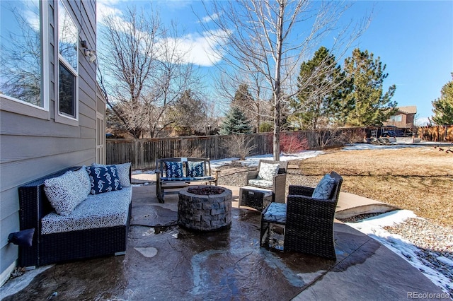 view of patio / terrace featuring a fenced backyard and an outdoor living space with a fire pit