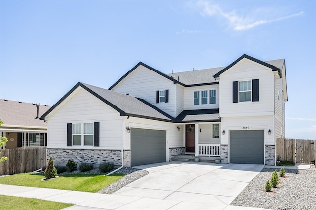 5840 Longs Peak St, Brighton, CO 80601 - view of front of property featuring stone siding, a porch, driveway, a garage, and a shingled roof