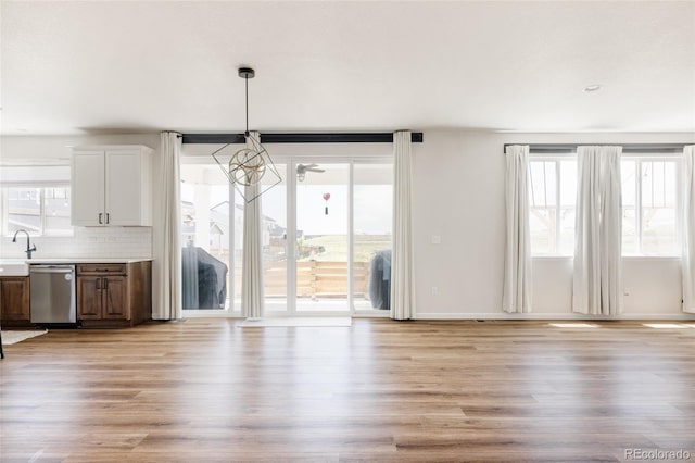 5840 Longs Peak St, Brighton, CO 80601 - unfurnished dining area with light wood-style floors