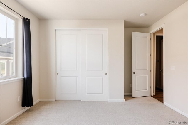 5840 Longs Peak St, Brighton, CO 80601 - unfurnished bedroom featuring light carpet and a closet