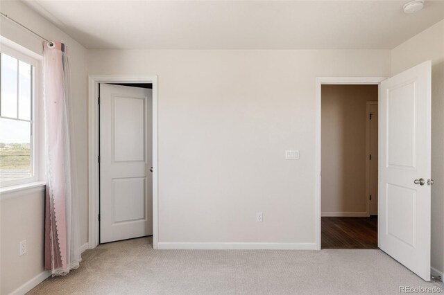 5840 Longs Peak St, Brighton, CO 80601 - unfurnished bedroom with carpet and multiple windows