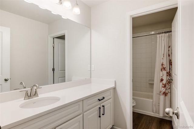 5840 Longs Peak St, Brighton, CO 80601 - full bathroom featuring vanity, shower / tub combo, and wood finished floors