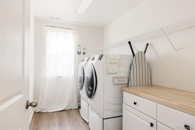 5840 Longs Peak St, Brighton, CO 80601 - washroom with washing machine and clothes dryer and light wood-type flooring