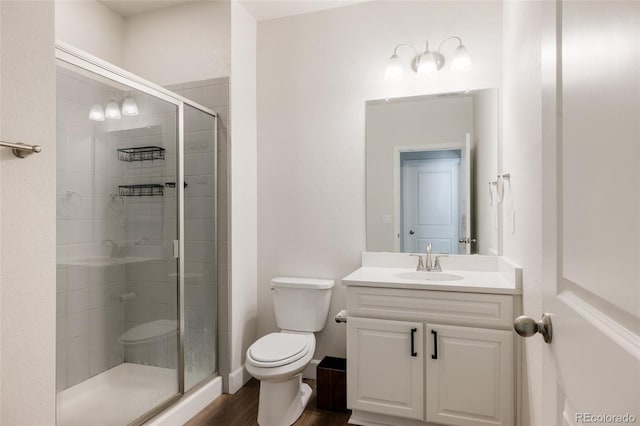5840 Longs Peak St, Brighton, CO 80601 - full bathroom with a stall shower, vanity, and wood finished floors