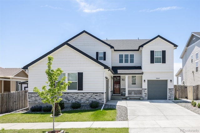 5840 Longs Peak St, Brighton, CO 80601 - view of front of property featuring stone siding, driveway, a porch, and a garage