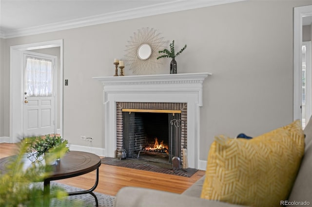 1033 Estes St, Lakewood, CO 80215 - living room with a brick fireplace, wood finished floors, and crown molding