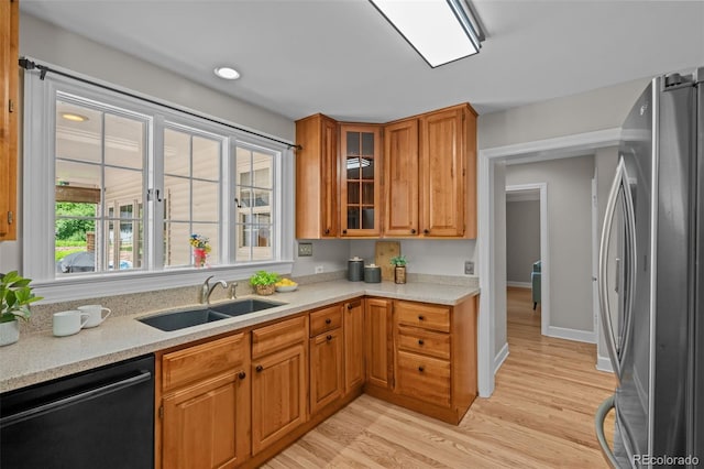 1033 Estes St, Lakewood, CO 80215 - kitchen featuring freestanding refrigerator, dishwasher, light countertops, light wood-style floors, and recessed lighting