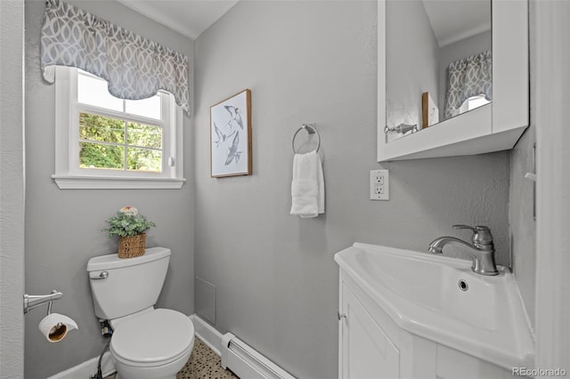 1033 Estes St, Lakewood, CO 80215 - bathroom with a baseboard heating unit and vanity