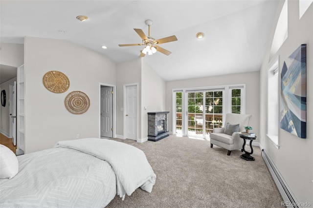1033 Estes St, Lakewood, CO 80215 - carpeted bedroom with a baseboard heating unit, lofted ceiling, a fireplace, and a ceiling fan