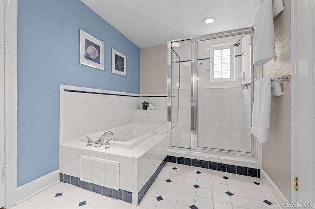 1033 Estes St, Lakewood, CO 80215 - bathroom featuring a shower stall, a garden tub, and tile patterned flooring