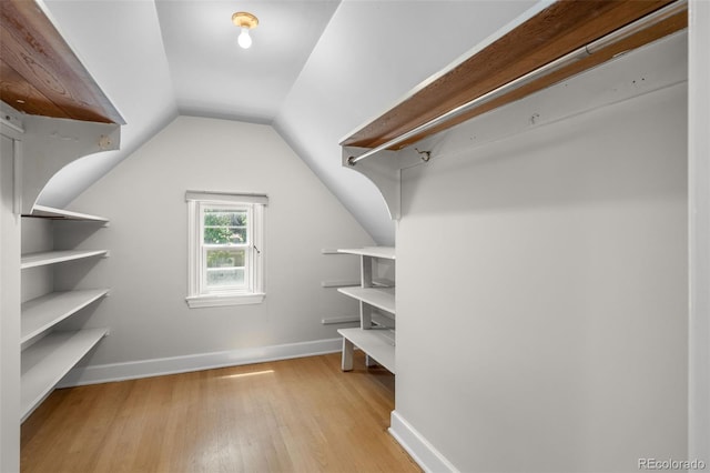 1033 Estes St, Lakewood, CO 80215 - walk in closet with wood finished floors and lofted ceiling