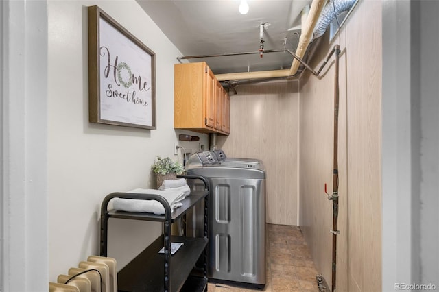 1033 Estes St, Lakewood, CO 80215 - laundry area with washer and dryer, cabinet space, and stone finish floors