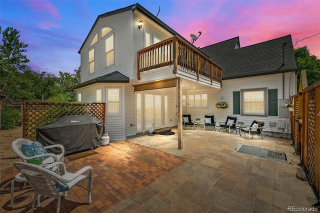 1033 Estes St, Lakewood, CO 80215 - back of house featuring a balcony, a shingled roof, and a patio