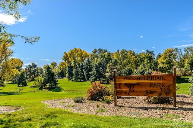 1033 Estes St, Lakewood, CO 80215 - community / neighborhood sign with a lawn and view of wooded area