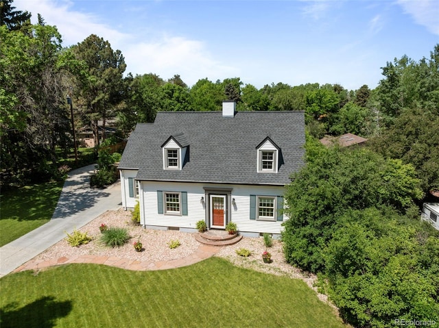 1033 Estes St, Lakewood, CO 80215 - new england style home with a front lawn, a shingled roof, and a chimney