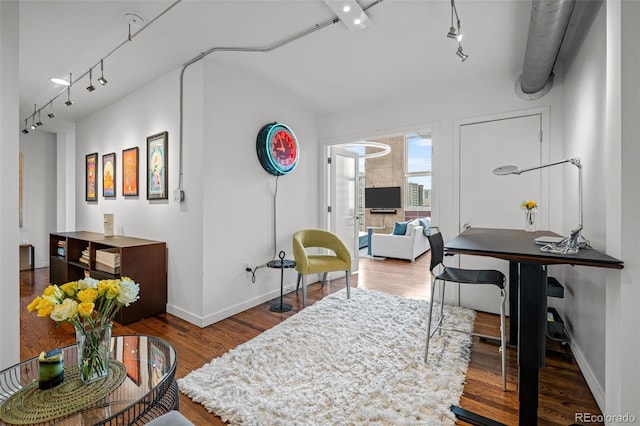 1050 Cherokee St Unit 403, Denver, CO 80204 - dining space featuring rail lighting, wood finished floors, and baseboards