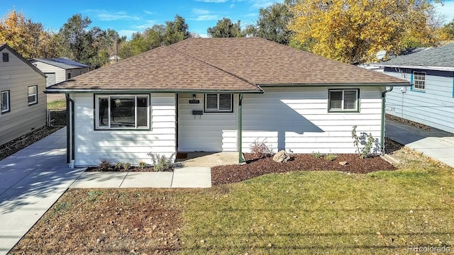 ranch-style home with a front yard