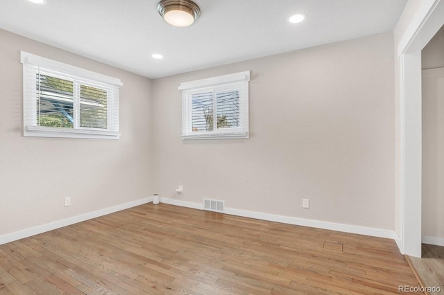 spare room with light wood-type flooring