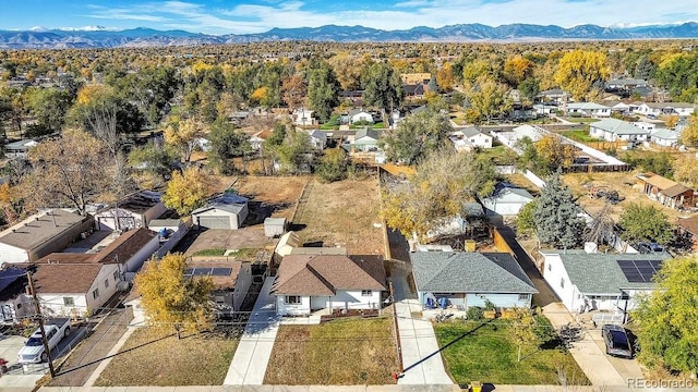 birds eye view of property featuring a mountain view