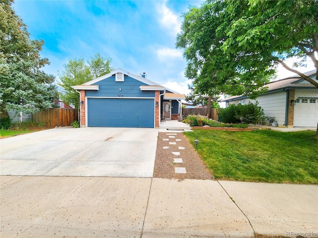 7978 S Johnson Ct, Littleton, CO 80128 - view of front facade featuring driveway, brick siding, and a garage