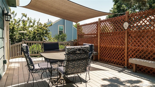 7978 S Johnson Ct, Littleton, CO 80128 - wooden deck with outdoor dining space