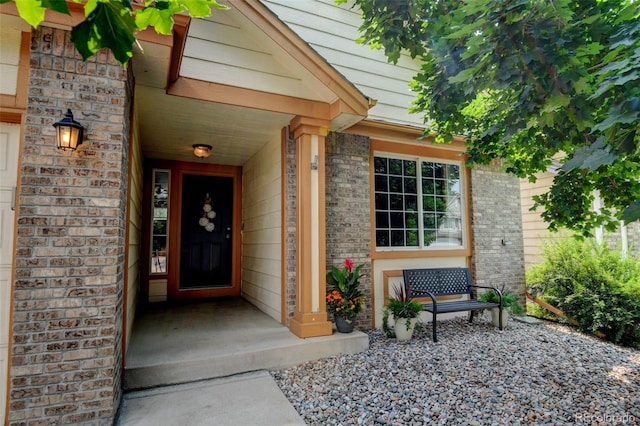 8829 S Dudley St, Littleton, CO 80128 - property entrance featuring brick siding