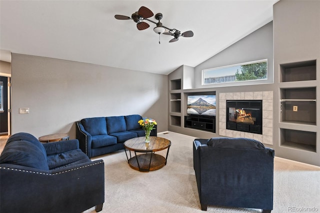 8829 S Dudley St, Littleton, CO 80128 - carpeted living area with built in features, ceiling fan, lofted ceiling, and a tile fireplace