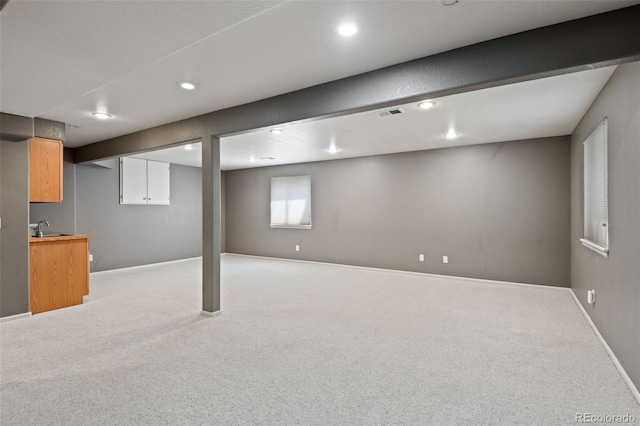 8829 S Dudley St, Littleton, CO 80128 - basement featuring light carpet and recessed lighting