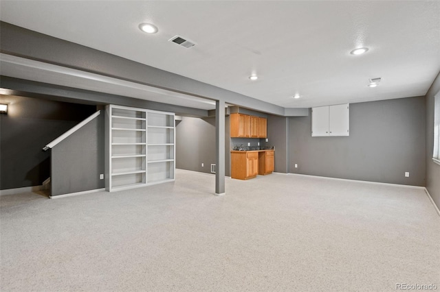 8829 S Dudley St, Littleton, CO 80128 - finished below grade area with bar, light carpet, and recessed lighting
