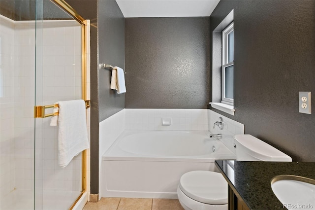 8829 S Dudley St, Littleton, CO 80128 - full bath featuring a garden tub, a textured wall, vanity, a stall shower, and tile patterned flooring