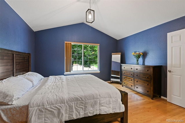 8829 S Dudley St, Littleton, CO 80128 - bedroom with lofted ceiling and wood finished floors