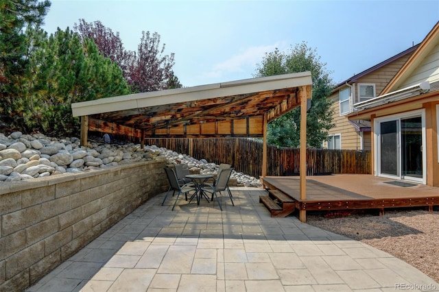 8829 S Dudley St, Littleton, CO 80128 - view of patio featuring a deck, outdoor dining space, and a pergola