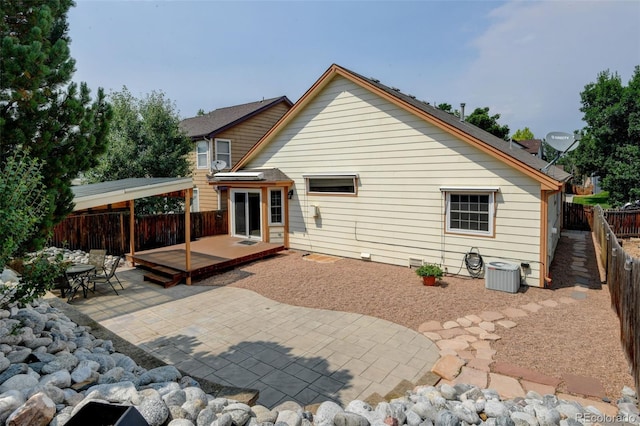 8829 S Dudley St, Littleton, CO 80128 - rear view of property featuring a fenced backyard, a patio area, and a deck