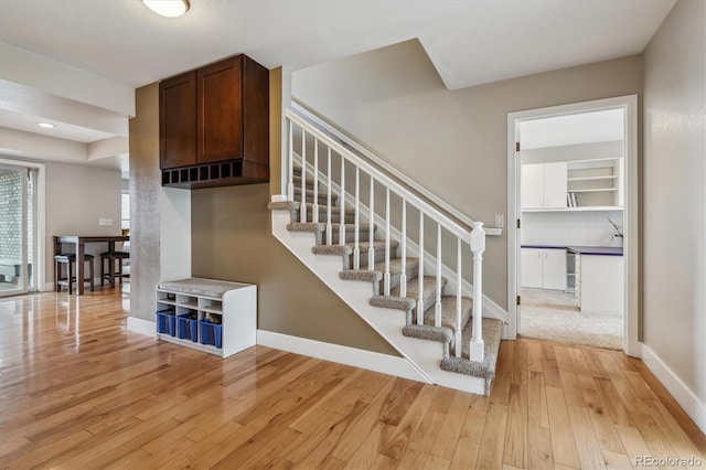 6062 S Emporia Cir, Englewood, CO 80111 - staircase featuring wood-type flooring and baseboards