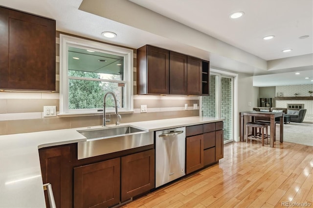 6062 S Emporia Cir, Englewood, CO 80111 - kitchen featuring light wood-type flooring, recessed lighting, light countertops, a sink, and dishwasher